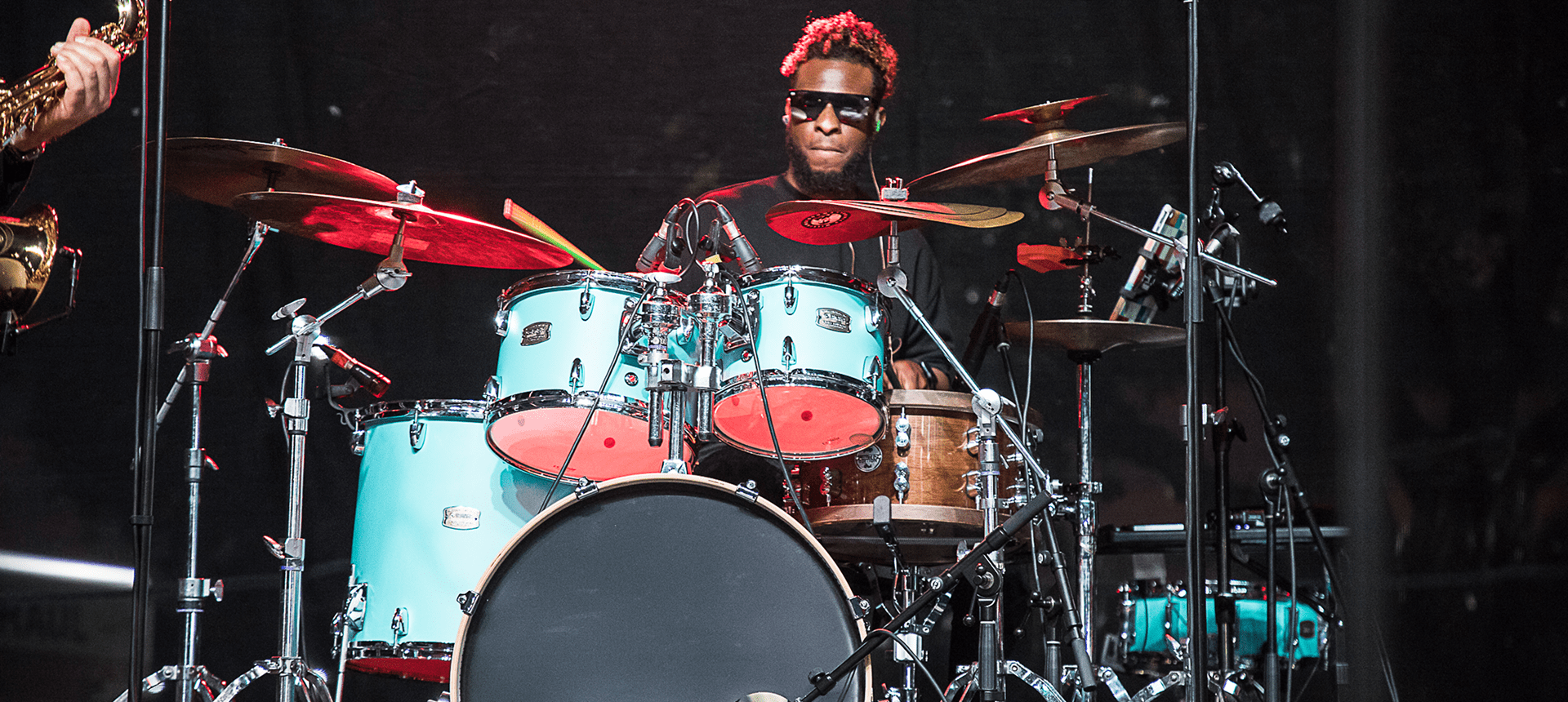 Musician playing drums at live concert