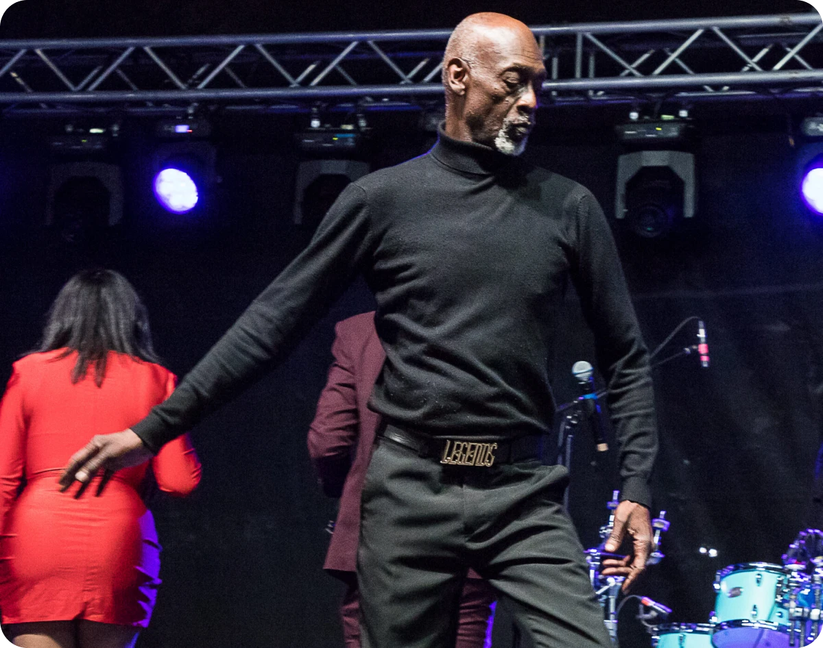 Man dancing on stage in black attire